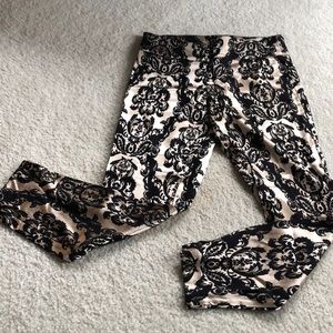 Gold and black shiny ankle leggings